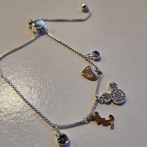 Disney Bracelet With 2 Light Pink Stones and a coppet Colored Mickey